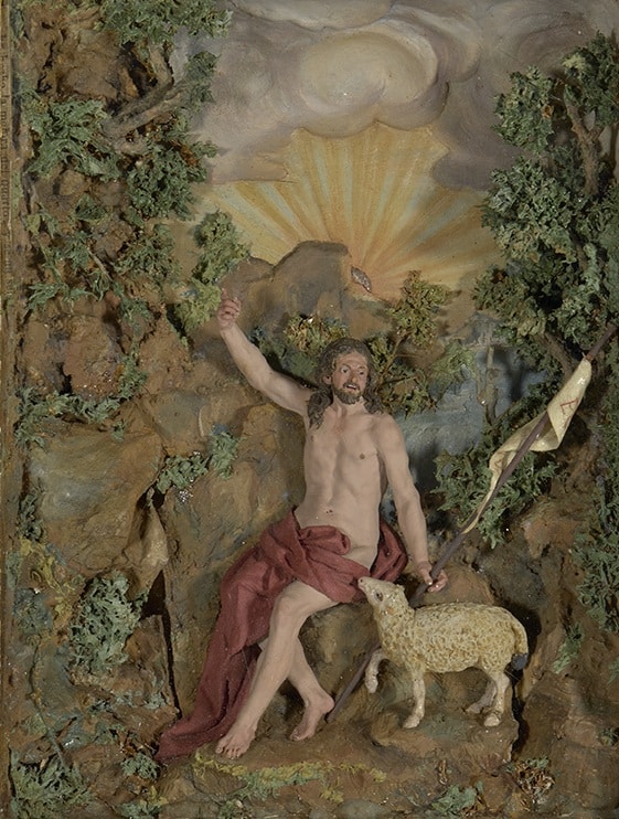 Diorama religiós amb Sant Joan Baptista assegut en paisatge rocós amb ovella i colom